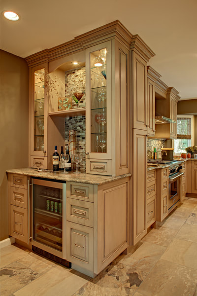 custom built home with custom cabinetry in the kitchen to create a dry bar