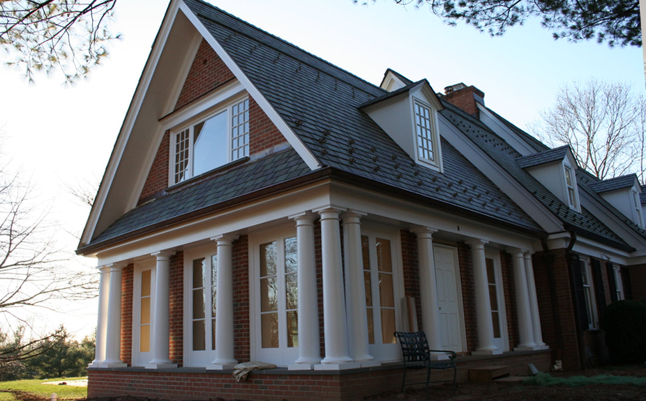exterior of new jersey home with painted white columns and custom millwork - historical restoration